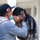 afael Eduardo (left) an undocumented immigrant from Venezuela hugs another immigrant outside of the Saint Andrews Episcopal Church, on Marthas Vineyard.